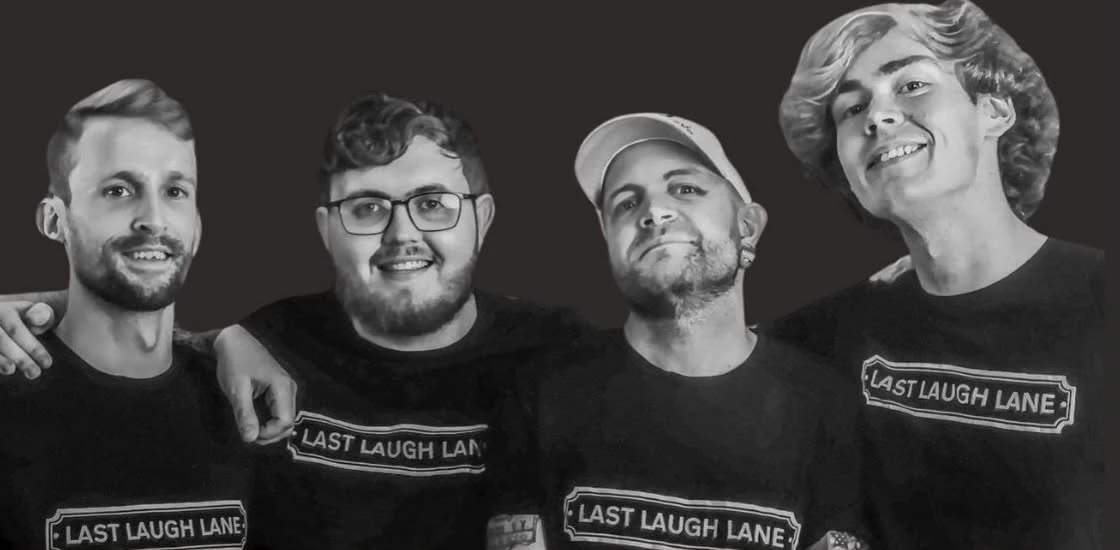Members of Last Laugh Lane together, wearing the band's street-sign logo